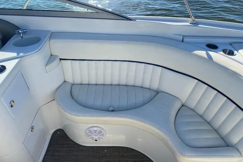 Slide: The Image of Luxurious seating area on a 2002 Cobalt 282 boat with white upholstery. - 9