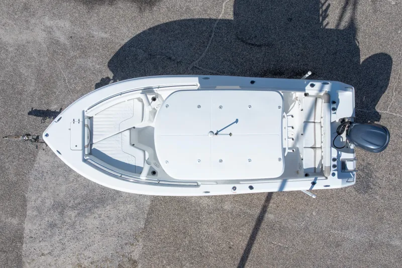 Slide: The Image of Overhead view of 2012 Sea Hunt Ultra 225 boat on pavement. - 11