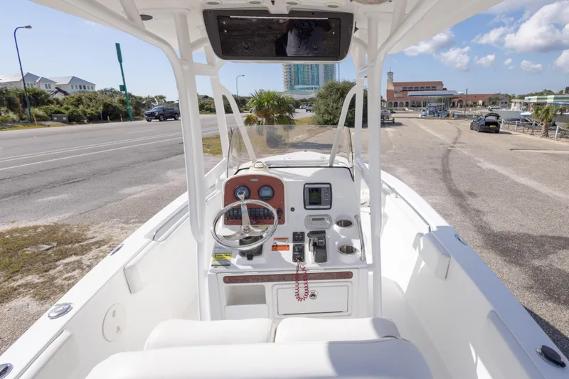 Slide: The Image of 2012 Sea Hunt Ultra 225 boat interior with steering console and dashboard controls. - 16