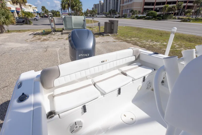 Slide: The Image of 2012 Sea Hunt Ultra 225 boat with Yamaha 200 engine, parked near a road. - 27