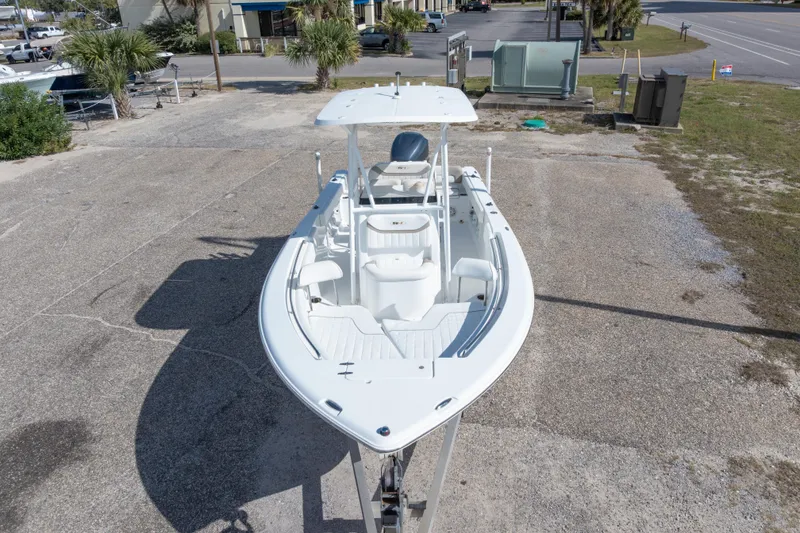 Slide: The Image of 2012 Sea Hunt Ultra 225 boat on trailer, parked in a lot. - 9