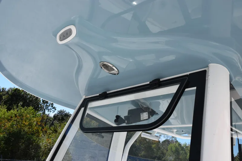 Slide: The Image of 2026 Sea Hunt Ultra 265 SE boat roof and window detail with sleek design. - 13