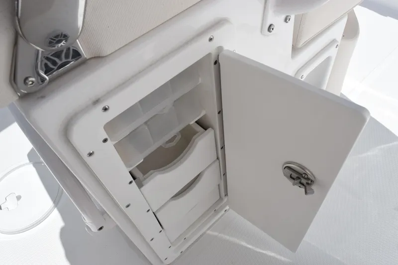Slide: The Image of Open storage compartment on 2026 Sea Hunt Ultra 265 SE boat. - 14