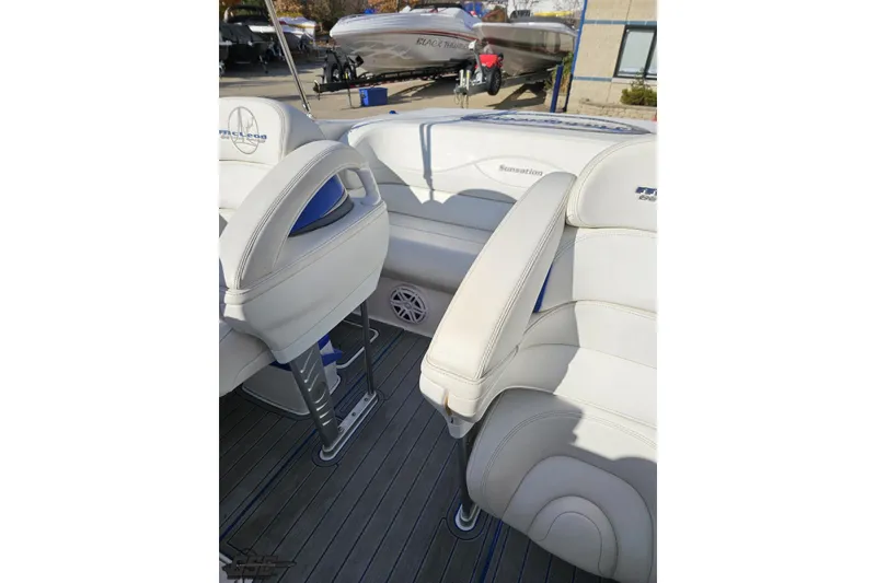 Slide: The Image of 2010 Sunsation 288 MID-CABIN boat interior with white leather seating and sleek design. - 102