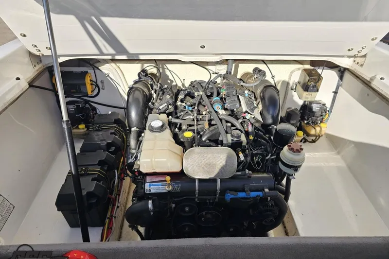 Slide: The Image of 2010 Sunsation 288 MID-CABIN boat engine compartment with visible components and wiring. - 106