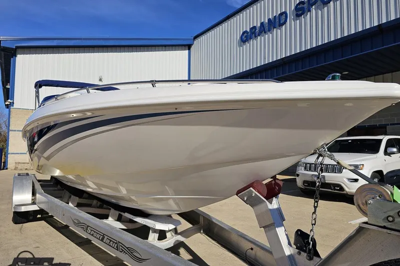 Slide: The Image of 2010 Sunsation 288 MID-CABIN - OPEN BOW boat on trailer at Grand Sport facility. - 17
