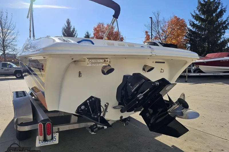 Slide: The Image of 2010 Sunsation 288 MID-CABIN boat on trailer, rear view with outboard motor. - 30