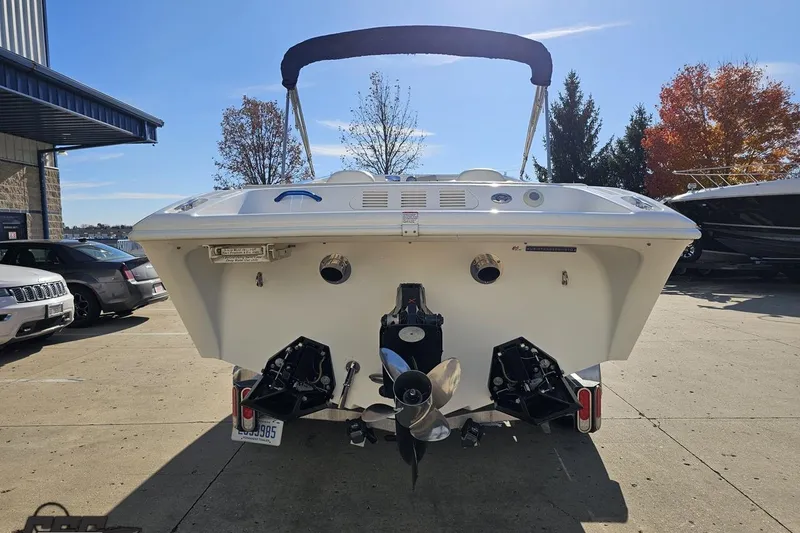Slide: The Image of 2010 Sunsation 288 MID-CABIN boat, rear view, parked outdoors on a sunny day. - 31