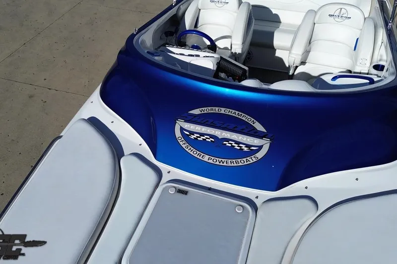 Slide: The Image of 2010 Sunsation 288 MID-CABIN OPEN BOW powerboat with sleek blue and white design. - 43