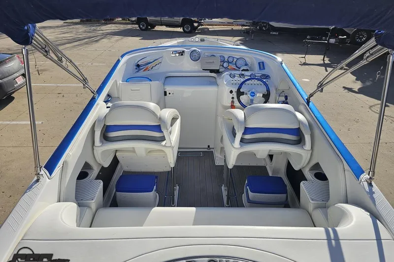 Slide: The Image of 2010 Sunsation 288 MID-CABIN - OPEN BOW boat interior with blue and white seating. - 50