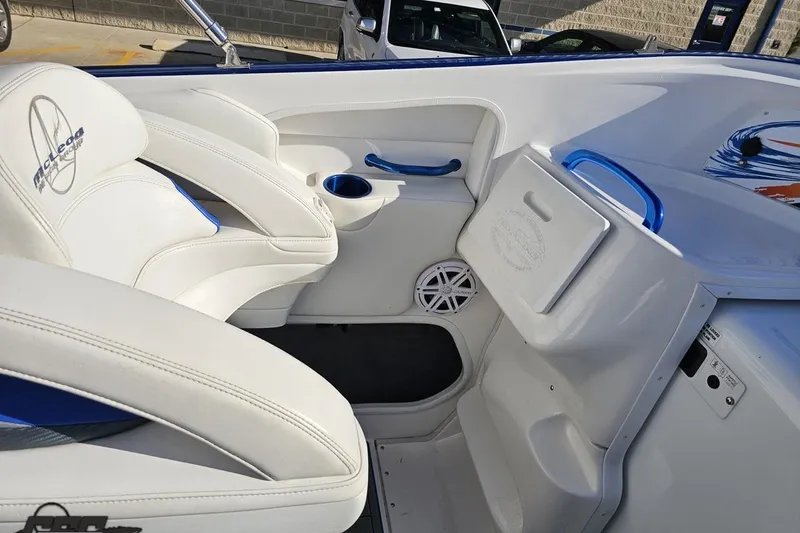 Slide: The Image of 2010 Sunsation 288 MID-CABIN boat interior with white seating and blue accents. - 59