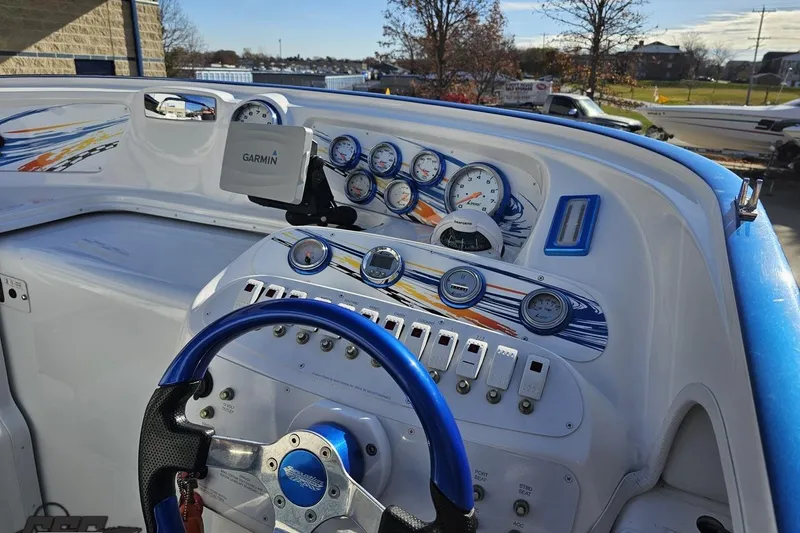 Slide: The Image of 2010 Sunsation 288 MID-CABIN boat dashboard with Garmin GPS and colorful gauges. - 65