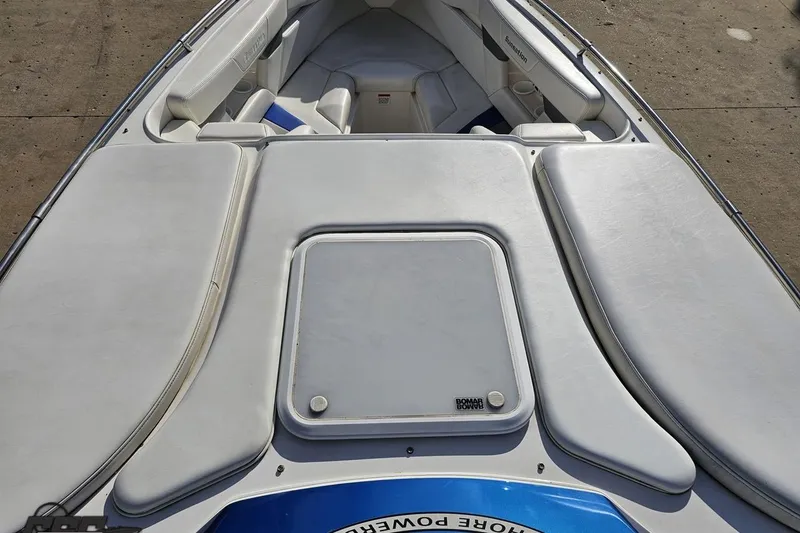 Slide: The Image of 2010 Sunsation 288 MID-CABIN OPEN BOW boat interior with cushioned seating and storage. - 71