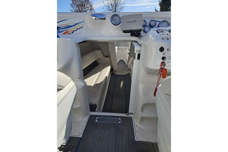 Slide: The Image of 2010 Sunsation 288 MID-CABIN boat interior with Garmin navigation and sleek seating. - 73