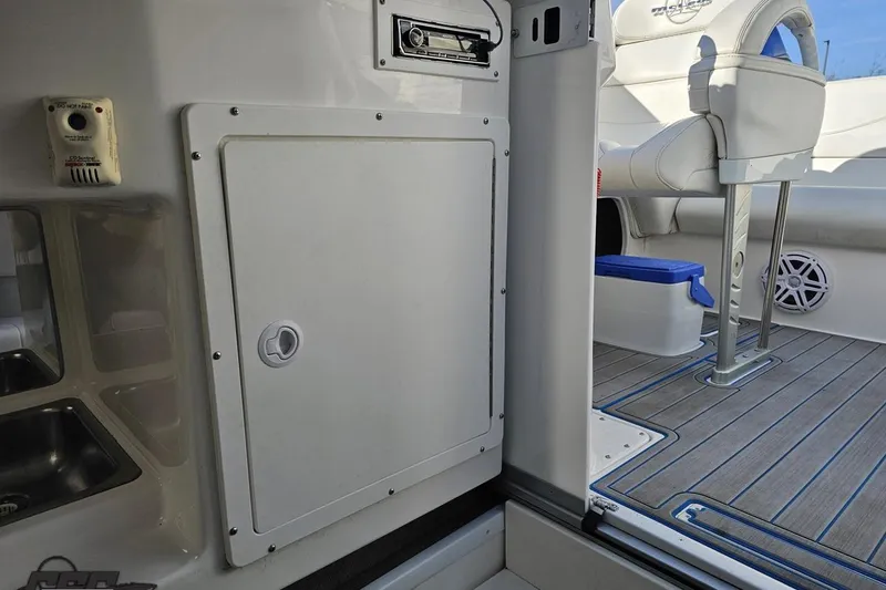 Slide: The Image of 2010 Sunsation 288 MID-CABIN boat interior with seating and storage compartments. - 78