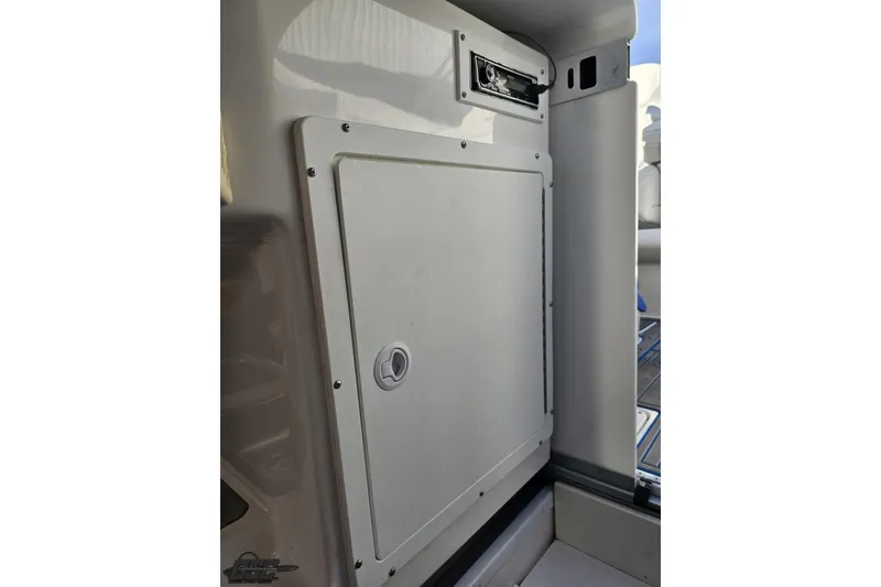 Slide: The Image of 2010 Sunsation 288 MID-CABIN interior storage compartment with sleek design. - 79