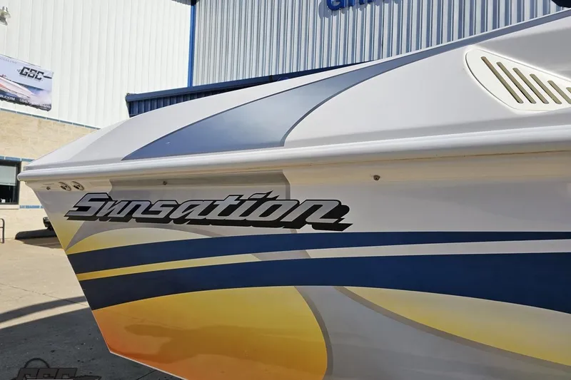 Slide: The Image of 2010 Sunsation 288 MID-CABIN - OPEN BOW boat with vibrant graphics and logo. - 8