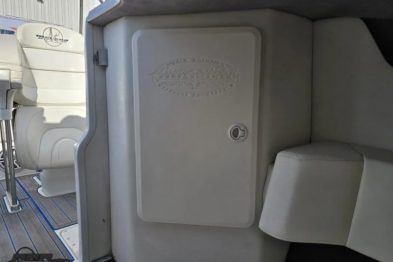 Slide: The Image of 2010 Sunsation 288 MID-CABIN interior with white seating and storage compartment. - 84