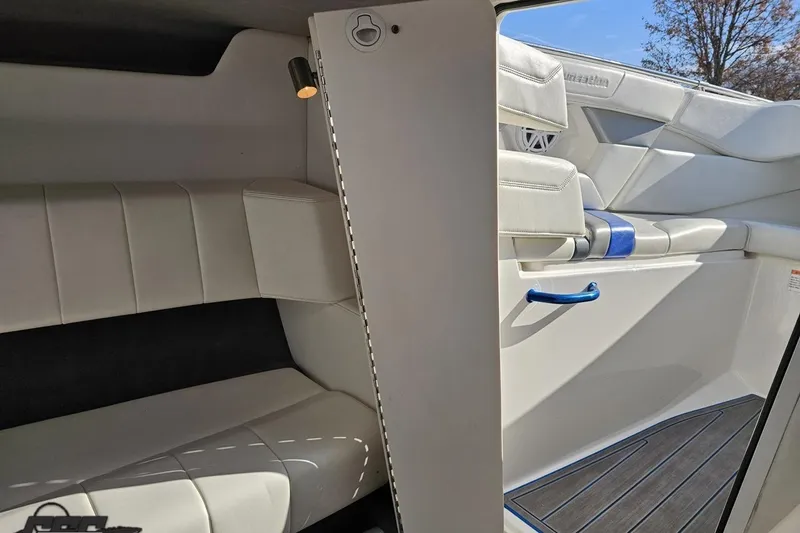 Slide: The Image of 2010 Sunsation 288 MID-CABIN interior with white seating and modern design. - 86