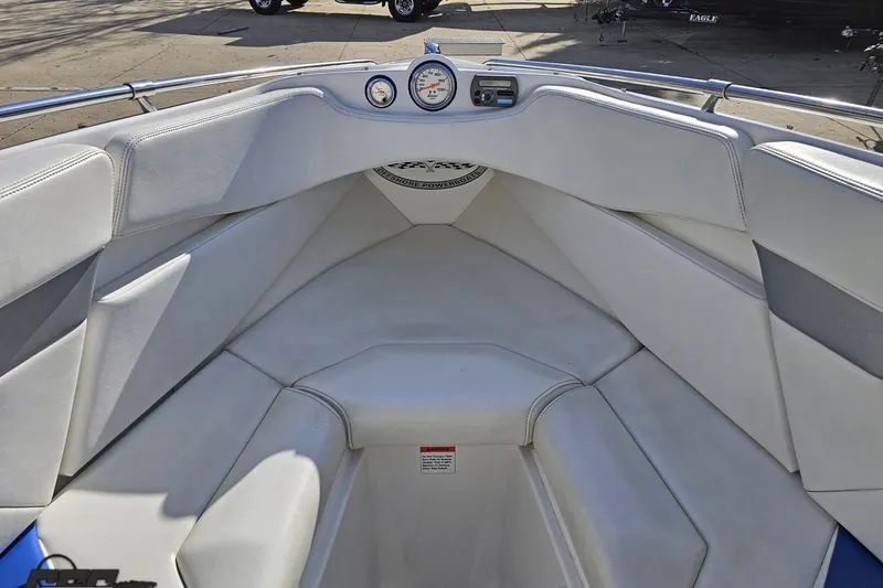 Slide: The Image of 2010 Sunsation 288 MID-CABIN OPEN BOW interior with white seating and dashboard gauges. - 89