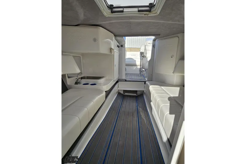 Slide: The Image of 2010 Sunsation 288 MID-CABIN interior with sleek seating and modern amenities. - 94