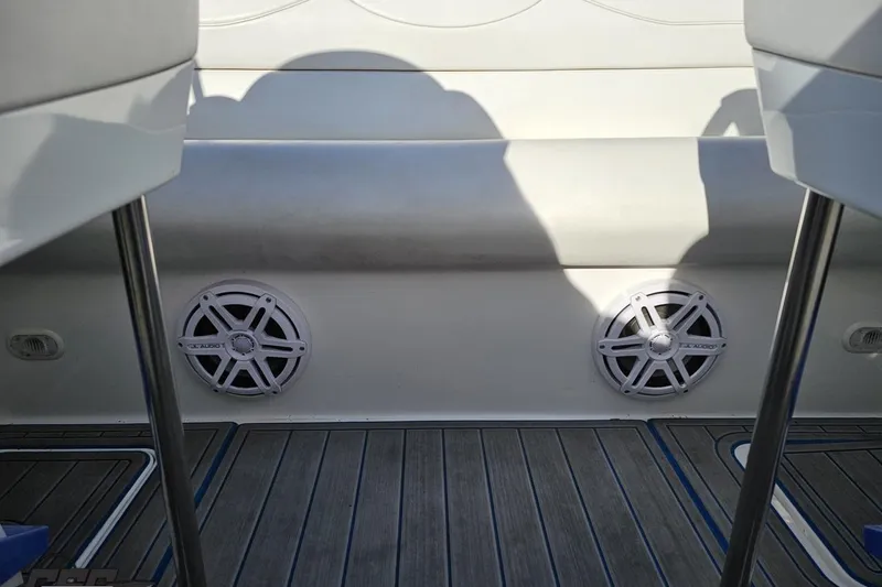 Slide: The Image of 2010 Sunsation 288 MID-CABIN boat interior with speakers and seating. - 98