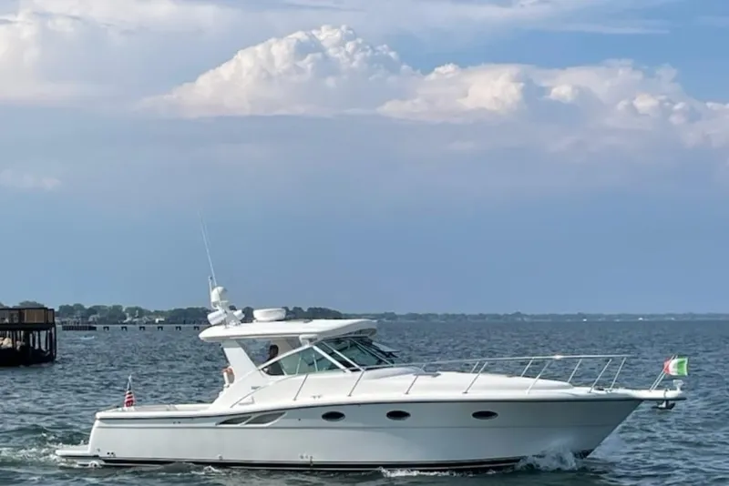 The Image of 2001 Tiara Yachts 3500 Open cruising on a calm sea under a cloudy sky. - 0