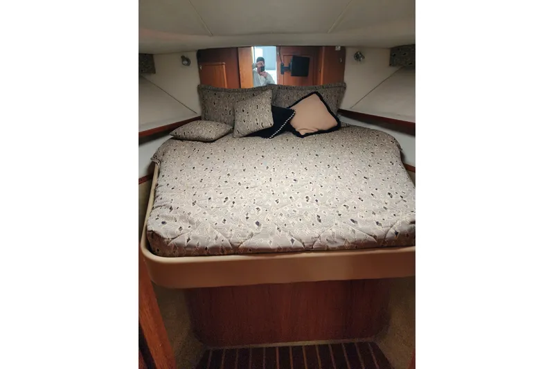 Slide: The Image of 2001 Tiara Yachts 3500 Open cabin with cozy bed and decorative pillows. - 14