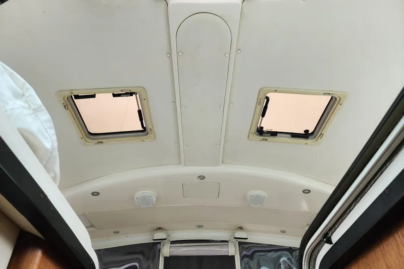 Slide: The Image of Interior ceiling view of a 2001 Tiara Yachts 3500 Open, featuring two hatches. - 17