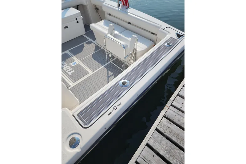 Slide: The Image of 2001 Tiara Yachts 3500 Open boat interior with seating and deck details. - 4