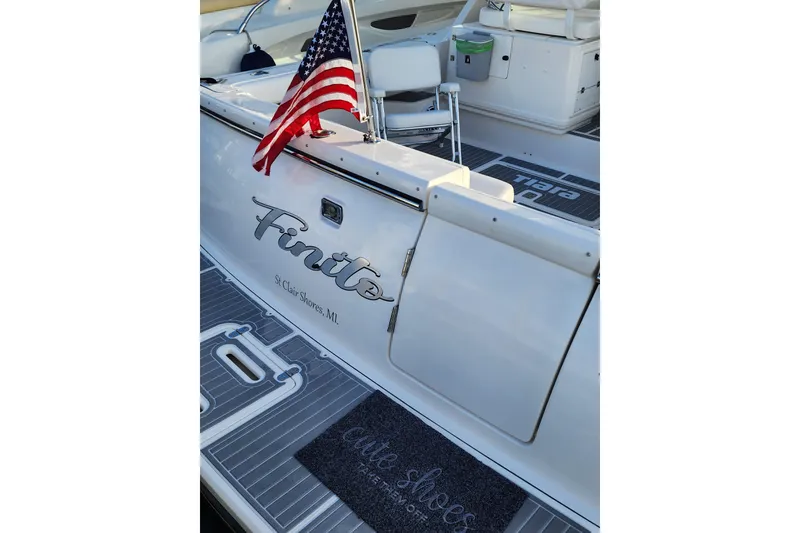 Slide: The Image of 2001 Tiara Yachts 3500 Open with American flag, docked in St. Clair Shores, MI. - 5