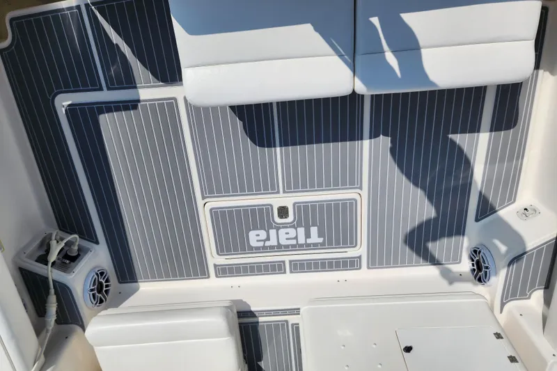 Slide: The Image of Tiara Yachts 3500 Open 2001 boat deck with gray and white striped flooring. - 6