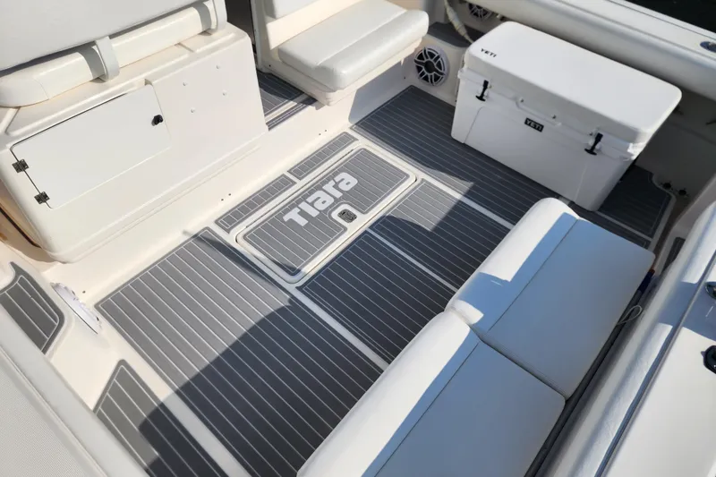 Slide: The Image of 2001 Tiara Yachts 3500 Open interior with seating and Yeti cooler on deck. - 7