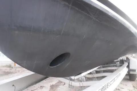 Slide: The Image of 2014 Newton 31 Dive Special boat hull on trailer, close-up view. - 11