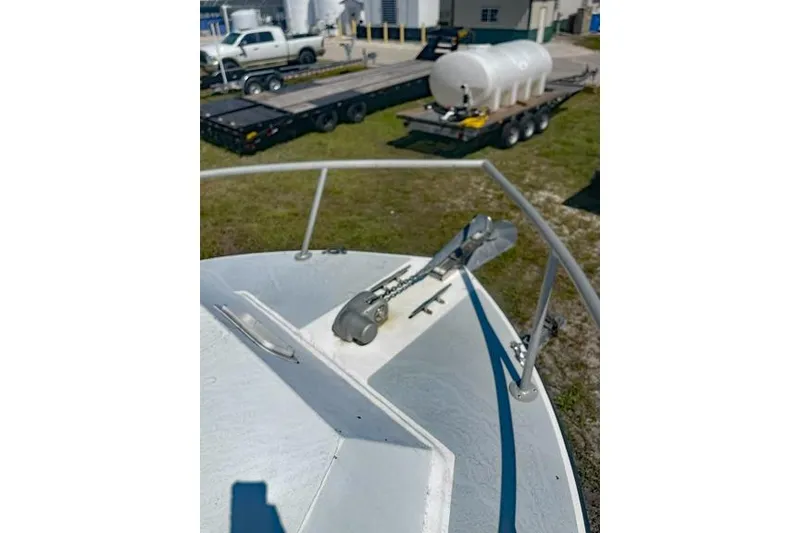 Slide: The Image of Bow of 2014 Newton 31 Dive Special boat with anchor, industrial background. - 13