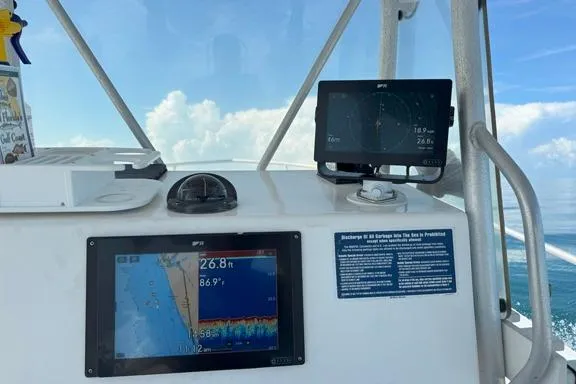 Slide: The Image of Boat dashboard with navigation screens on a 2014 Newton 31 Dive Special. - 5