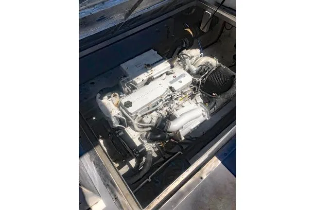 Slide: The Image of Engine compartment of a 2014 Newton 31 Dive Special boat, showcasing its mechanical components. - 6