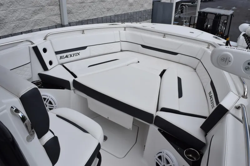 Slide: The Image of 2023 Blackfin 252 CC boat interior with white seating and modern design. - 13