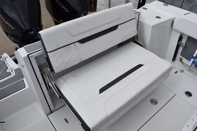 Slide: The Image of 2023 Blackfin 252 CC boat seating area with dual Mercury engines. - 20