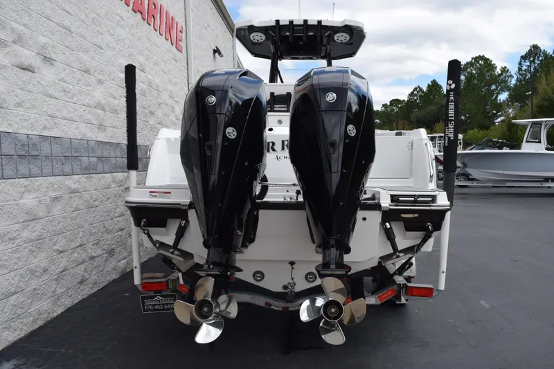 Slide: The Image of 2023 Blackfin 252 CC boat with dual outboard engines, rear view. - 5