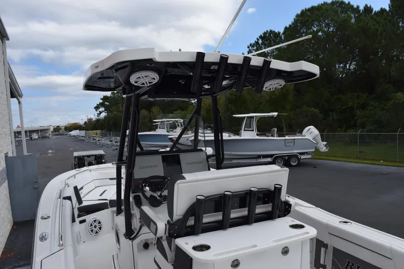 Slide: The Image of 2023 Blackfin 252 CC boat with advanced Garmin navigation, docked outdoors. - 8