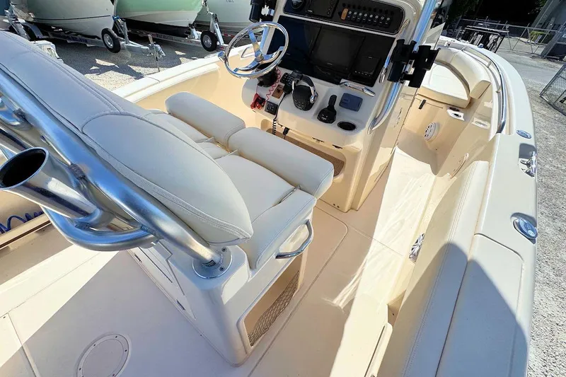 Slide: The Image of 2015 Grady-White Fisherman 257 boat interior with helm, seating, and control panel. - 10