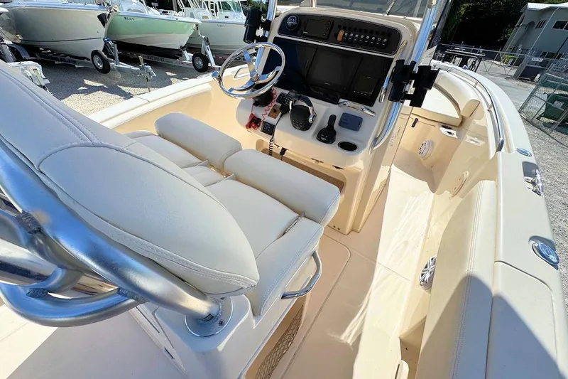 Slide: The Image of 2015 Grady-White Fisherman 257 boat interior with helm and seating area. - 11