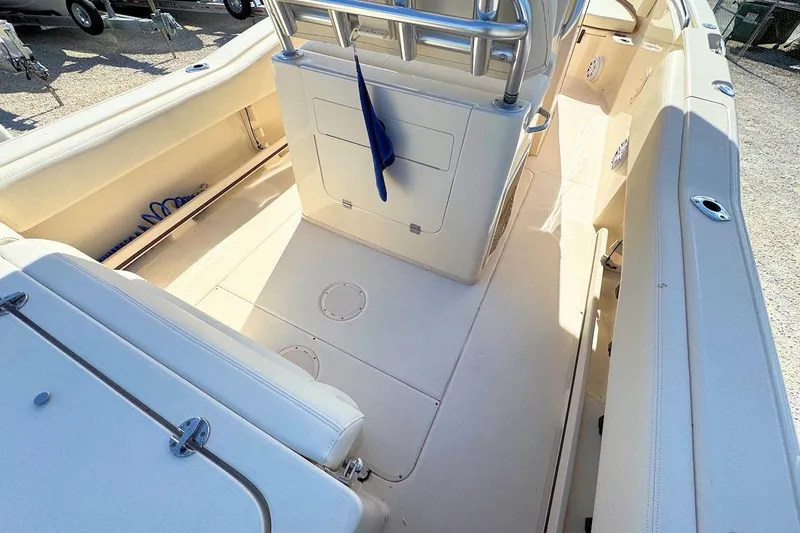 Slide: The Image of 2015 Grady-White Fisherman 257 boat interior, featuring spacious seating and storage areas. - 7