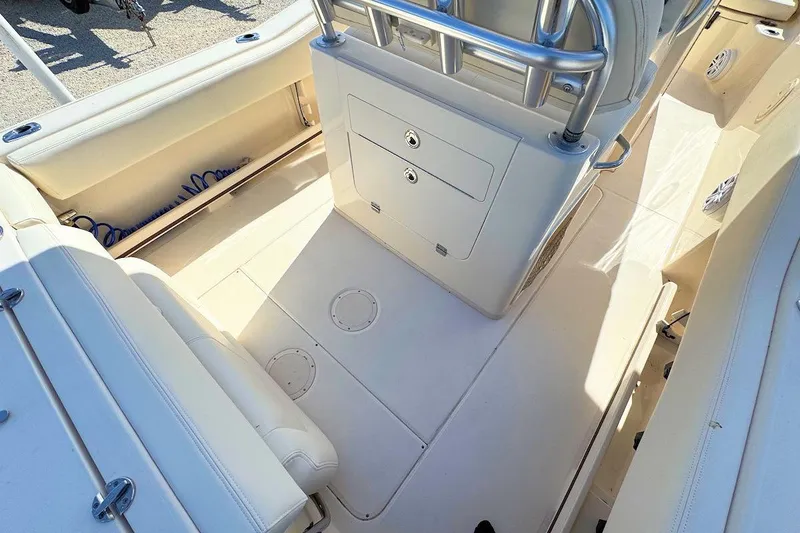 Slide: The Image of 2015 Grady-White Fisherman 257 boat interior with seating and storage compartments. - 8
