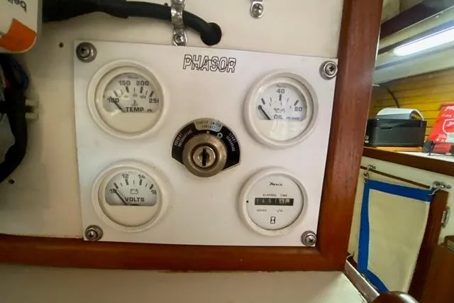 Slide: The Image of Control panel of a 1988 Morgan 44 boat with gauges and key ignition. - 34
