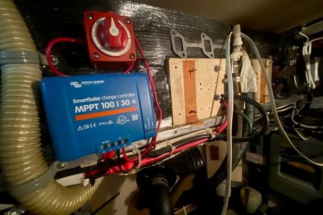 Slide: The Image of 1988 Morgan 44 boat interior with Victron Energy SmartSolar charge controller and wiring setup. - 39