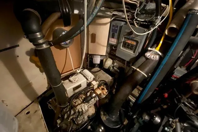 Slide: The Image of Engine compartment of a 1988 Morgan 44, showcasing mechanical components and wiring. - 40