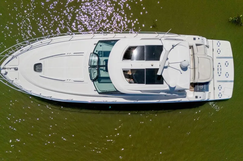 Slide: The Image of Aerial view of 2009 Sea Ray 470 Sundancer yacht on calm green water. - 19