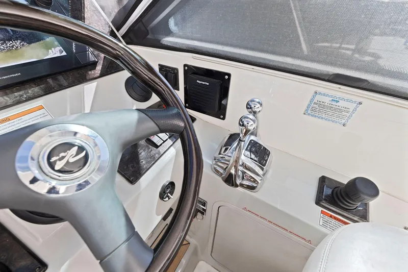Slide: The Image of Helm of 2009 Sea Ray 470 Sundancer yacht with steering wheel and controls. - 35